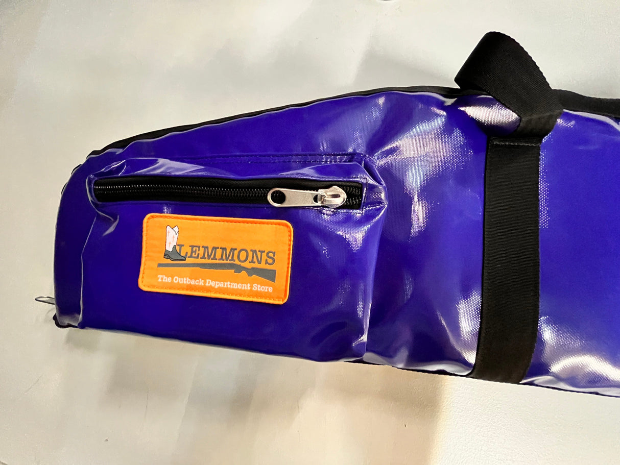 Blue bag with a black strap and orange label on a white background