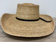 Wide-brimmed straw hat with a black band on a wooden surface