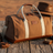 Pilbara Overnight Bag in brown with leather trims on rustic timber surface