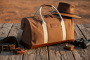 Pilbara Overnight Bag in brown with leather trims on rustic timber surface