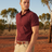 Man wearing Ritemate Pilbara Classic Polo in Maroon with Australian outback background