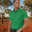 Man wearing Ritemate Pilbara Classic Polo in Emerald with Australian outback background