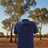 Man wearing Ritemate Pilbara Classic Polo in French Navy with Australian outback background